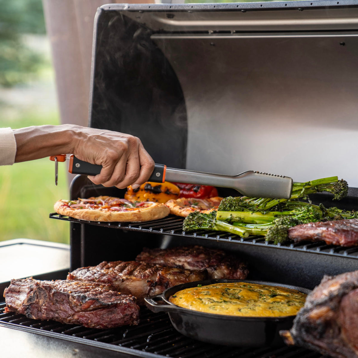 Traeger BAC790 tongs with serrated edges for secure grip during turning
