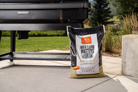 Traeger BBQ Select grill-with-pellets image suggests easy loading and dependable heat.