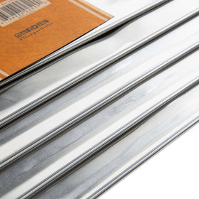 Traeger Woodridge liner being cut to fit for precise, flush installation.