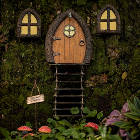 Tree Poetry glow windows add whimsical night ambiance to your garden