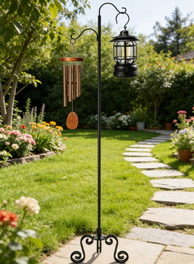 Treezitek shepherd's hook holding bird feeders, wind chimes, and lanterns.