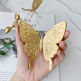Tricune gold butterfly sculpture wing detail showing craftsmanship