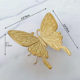 Tricune gold butterfly sculpture side profile with delicate detailing