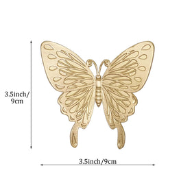 Tricune gold butterfly sculpture top view highlighting compact size and finish