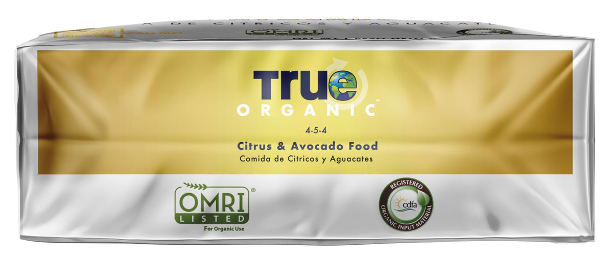 True Organic Citrus & Avocado Food granules on soil illustrate simple application.