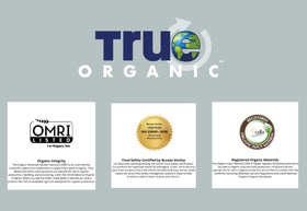 True Organic Liquid All Purpose Plant Food being poured for dilution in water.