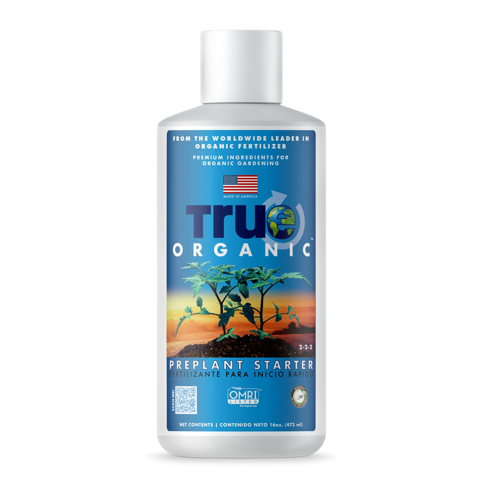 True Organic Liquid Preplant Starter bottle on a garden table for seedling growth