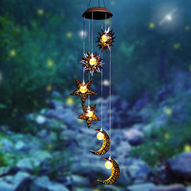 Tryme Solar Wind Chimes with sun-moon-star design for magical garden ambiance.