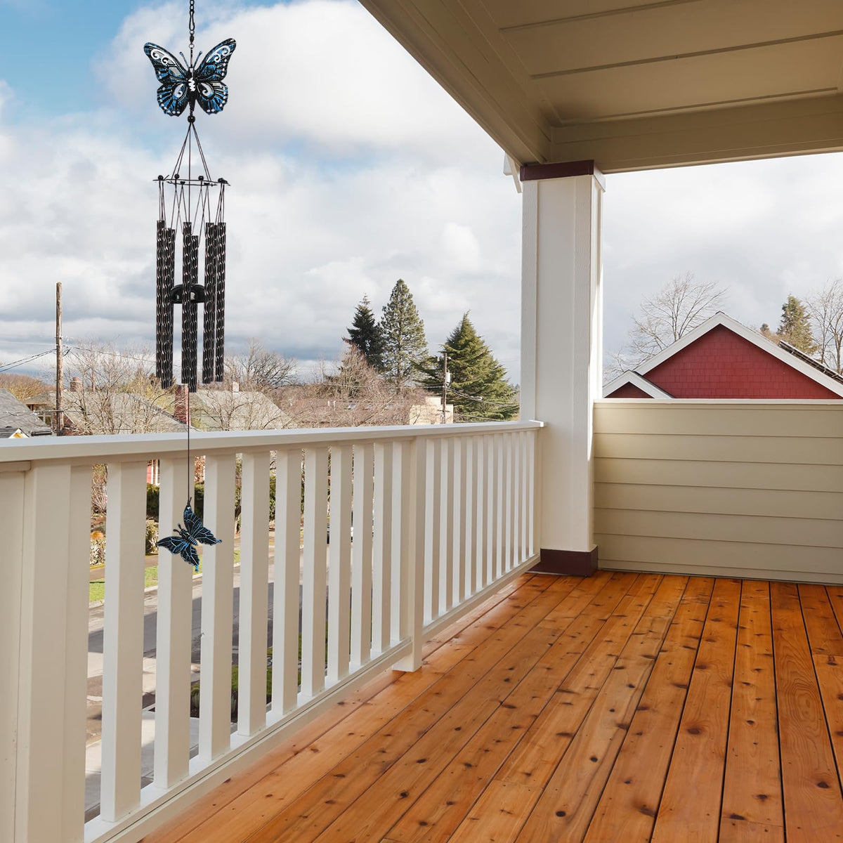 Tuned Wind wind chime shimmering in sunlight for sensory garden ambiance.