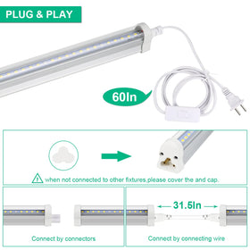 TVTUTPWY T5 Grow Lights in an indoor garden with lush plants