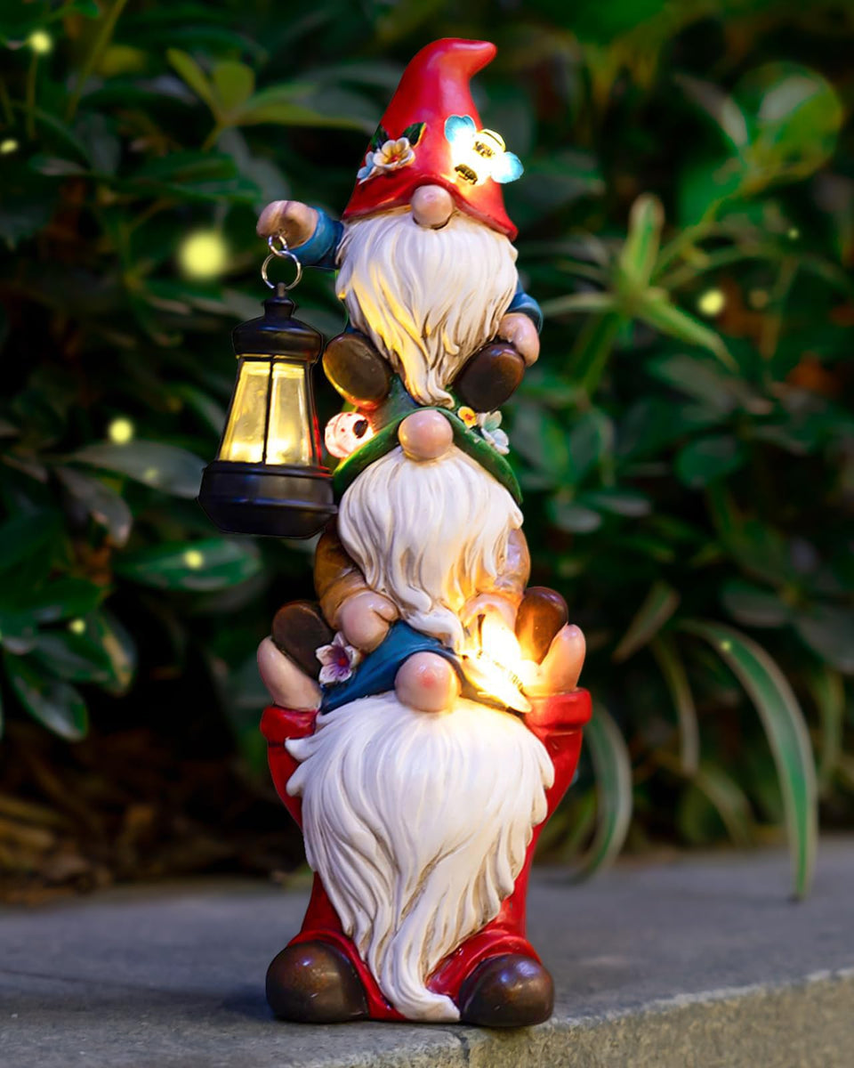 Twinbling garden gnome with solar lantern lights your yard at night.