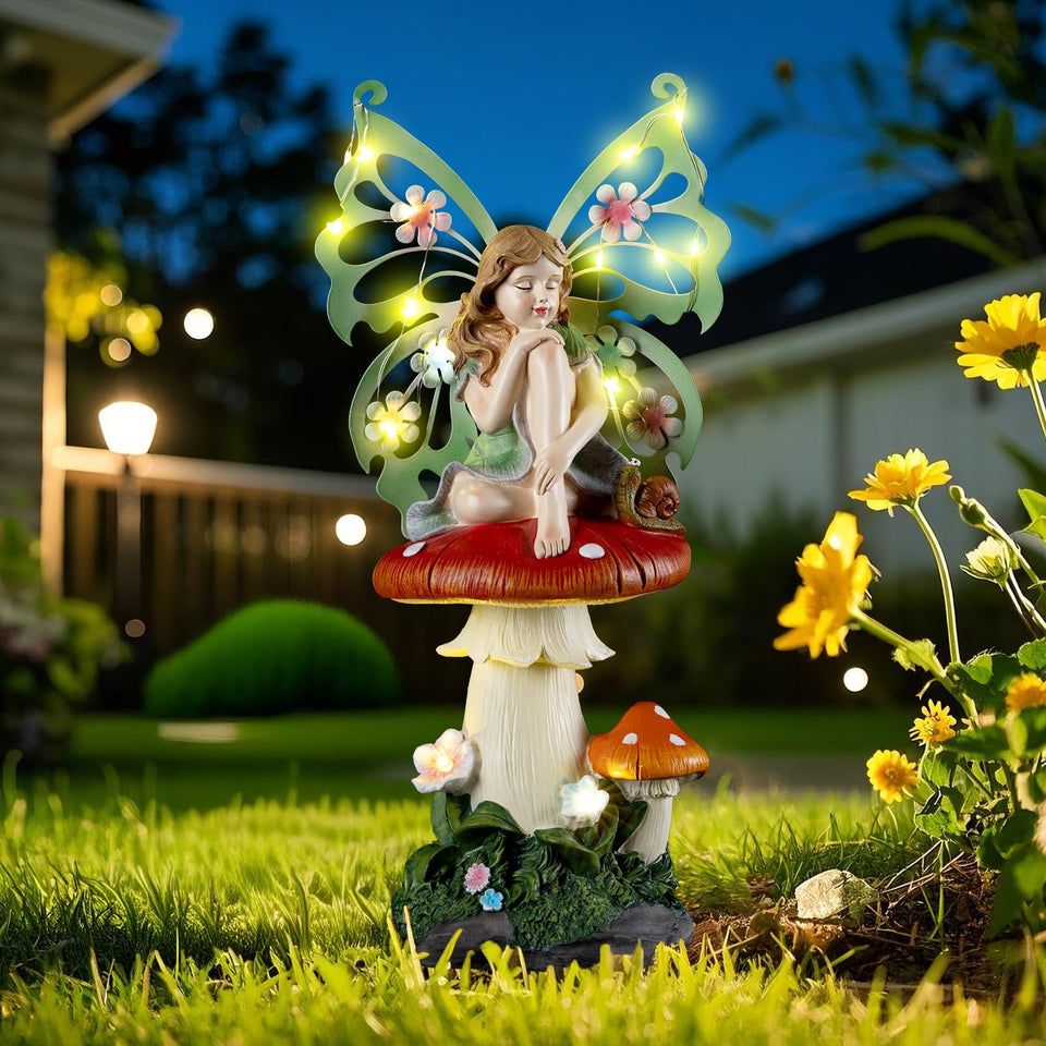 Twinbling solar fairy garden statue on a mushroom enhances yard charm.