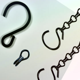 Uarepretty garden setup with lanterns and bird feeder.