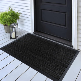 ubdyo dirt-trapper grass and rubber mat traps mud at the doorway.
