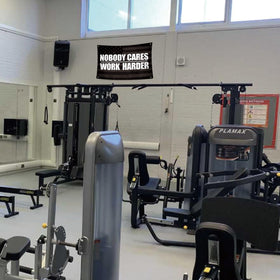 UCNMWBJ Garage workout banner doubles as backdrop