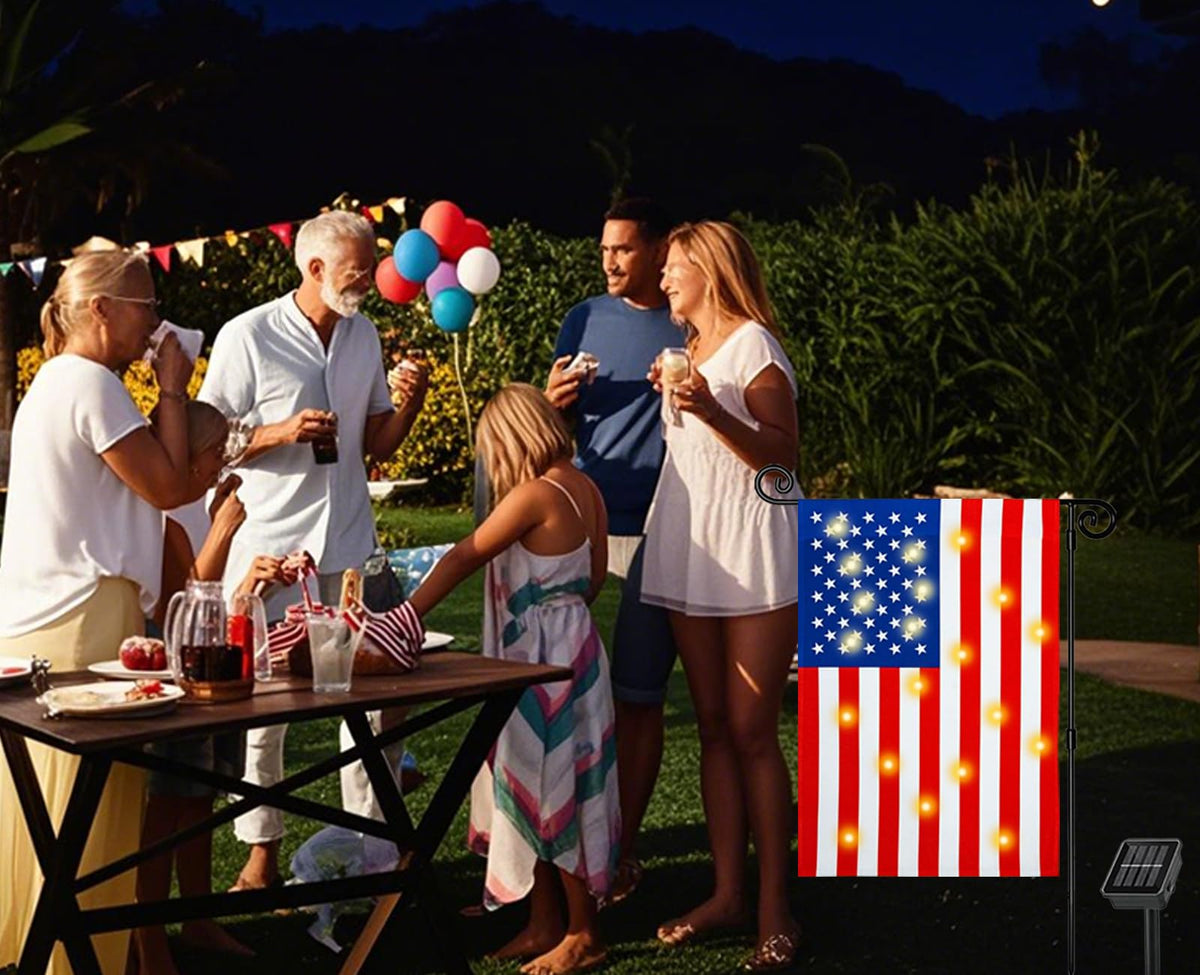 Patriotic garden flag at night enhances curb appeal and mood.