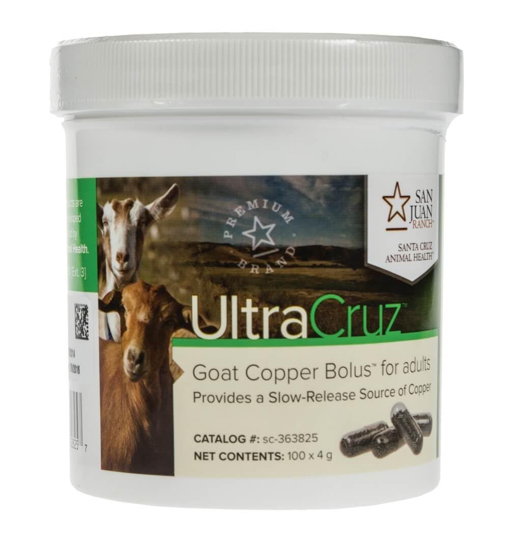 A hand holds UltraCruz Goat Copper Bolus ready for easy administration