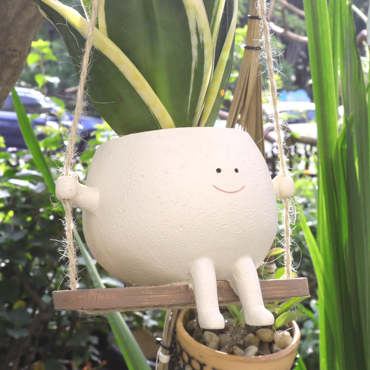 UMESONG Swing Face Planter hanging resin pot for indoor decor and plant display.