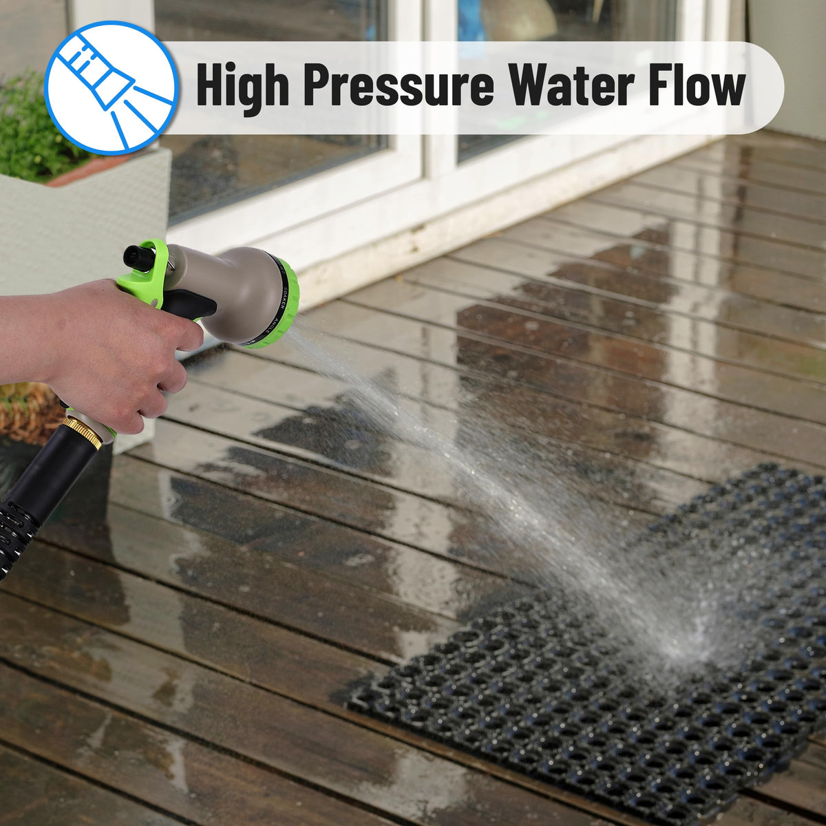 50-foot UNCO hose extended across a garden bed for broad coverage
