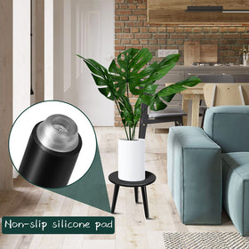 Uneededem small round table doubles as a plant stand and side table