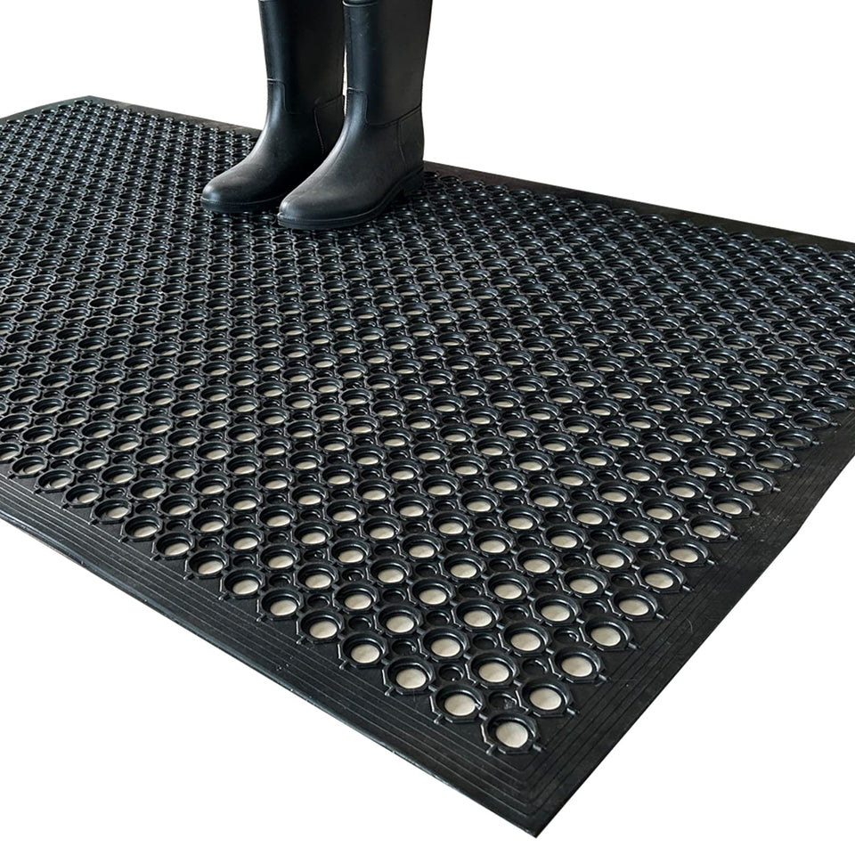 Uniboho outdoor rubber floor mat with hex drainage holes for slip resistance.