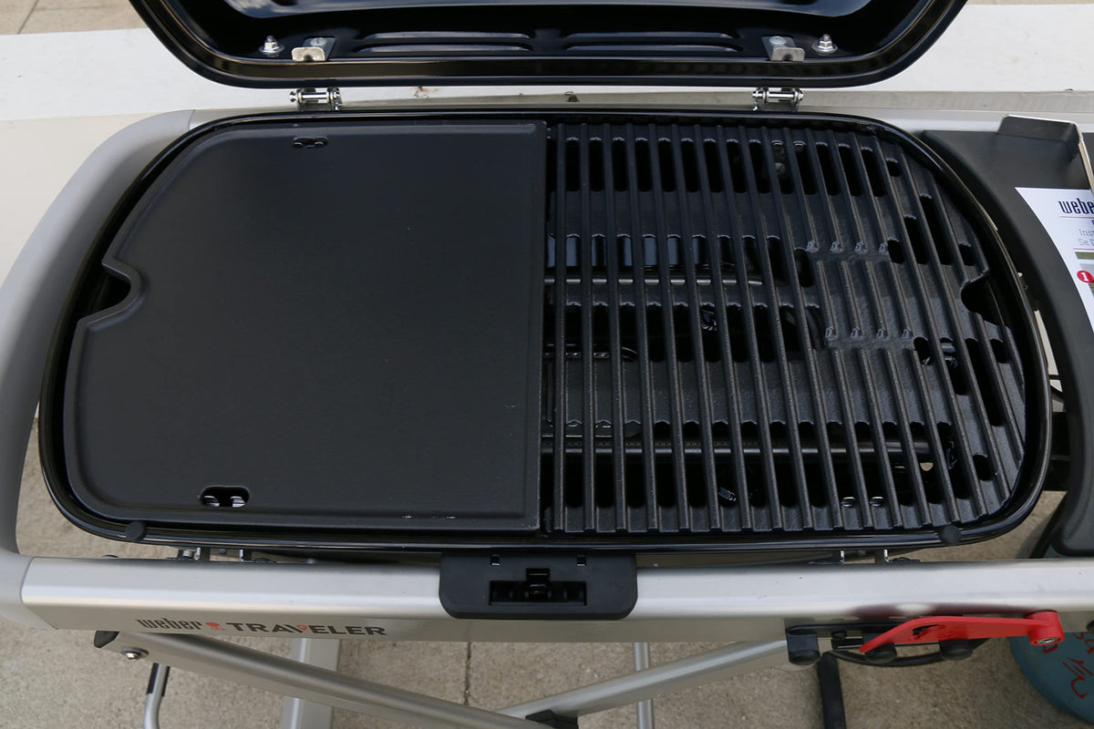 Uniflasy cast iron griddle half-coverage on Weber Traveler expands cooking space