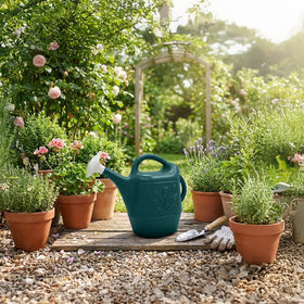 Union Products Watering Can with top and side handles for comfortable pouring.