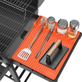 Uozuke silicone griddle mat with drip pad keeps tools within reach on the Blackstone side shelf.