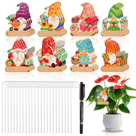 UPINS gnome marker stake set on wood for outdoor labeling and weather resistance.