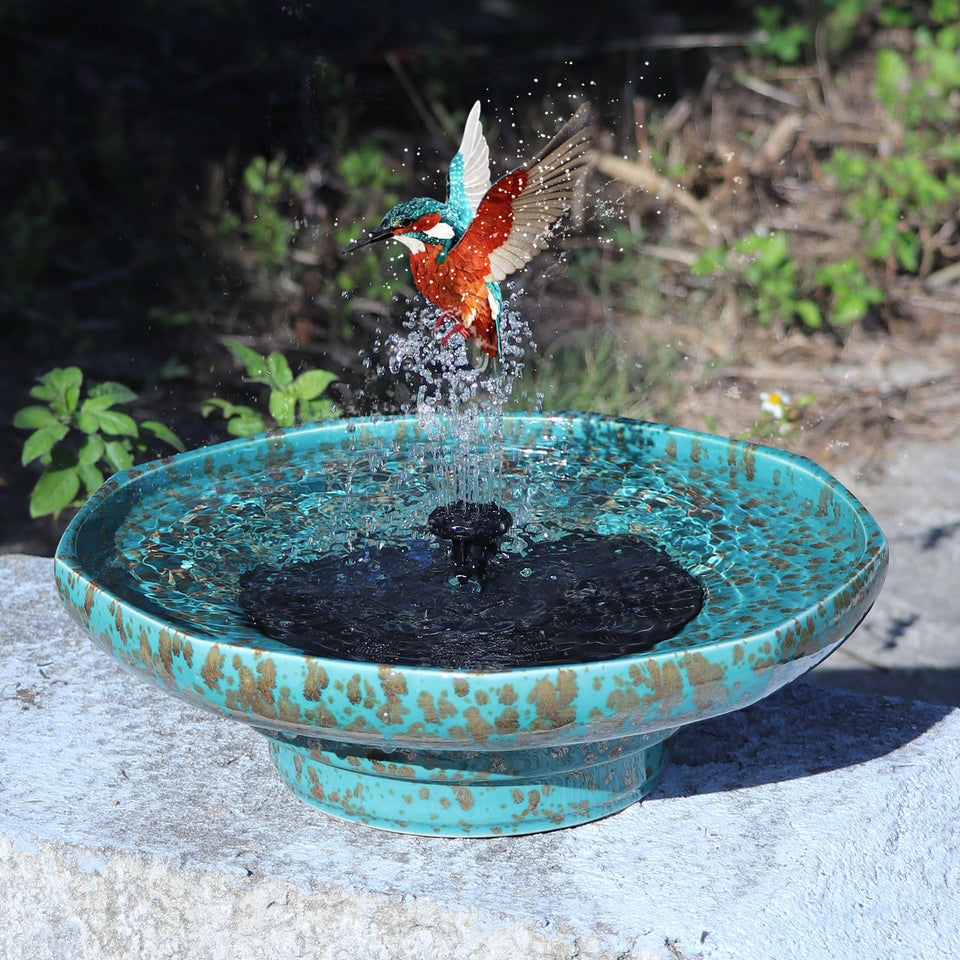 UPSJYJ solar fountain ceramic bird bath front view attracts birds in sunny gardens.
