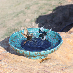 UPSJYJ solar fountain ceramic bird bath side view showing water movement for wildlife.