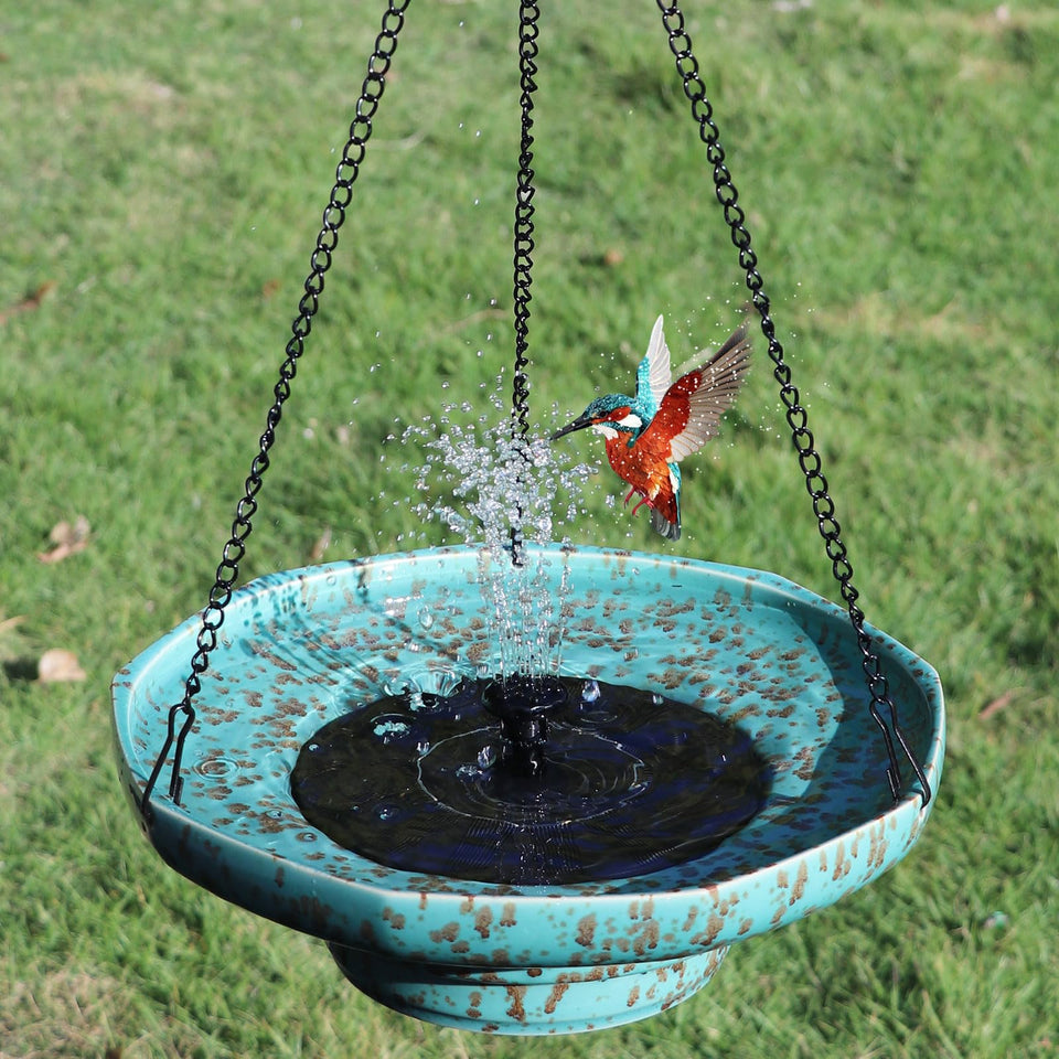 UPSJYJ solar fountain ceramic hanging bird bath in garden enhances bird activity with sun-powered water motion.