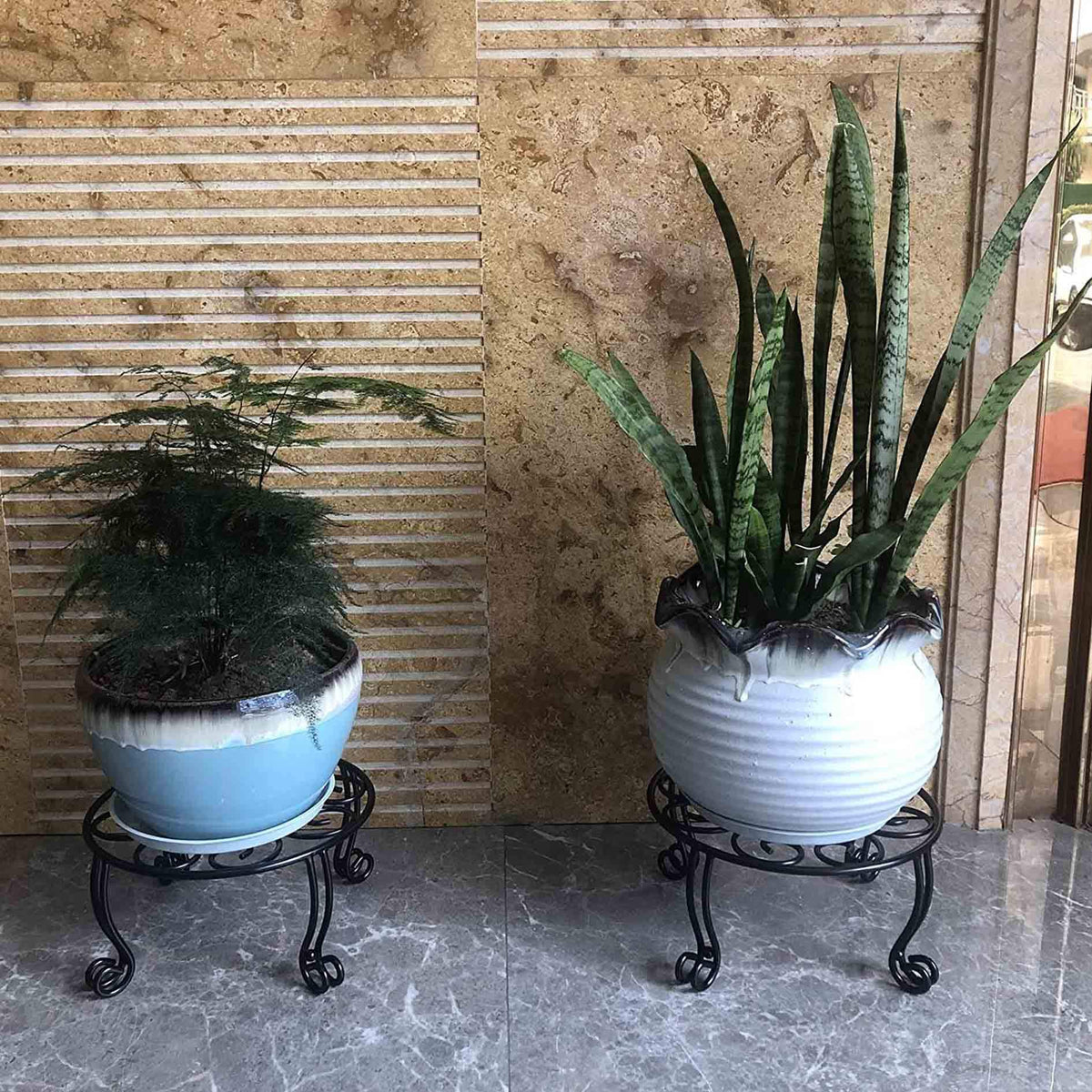 Uuuda metal outdoor plant stand side view shows stable four-leg design