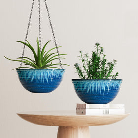 Vanslogreen blue glaze planter in garden setting demonstrates versatile styling.
