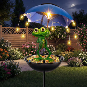 Vbioa Solar Frog Bird Feeder with umbrella light brightens the garden at night.