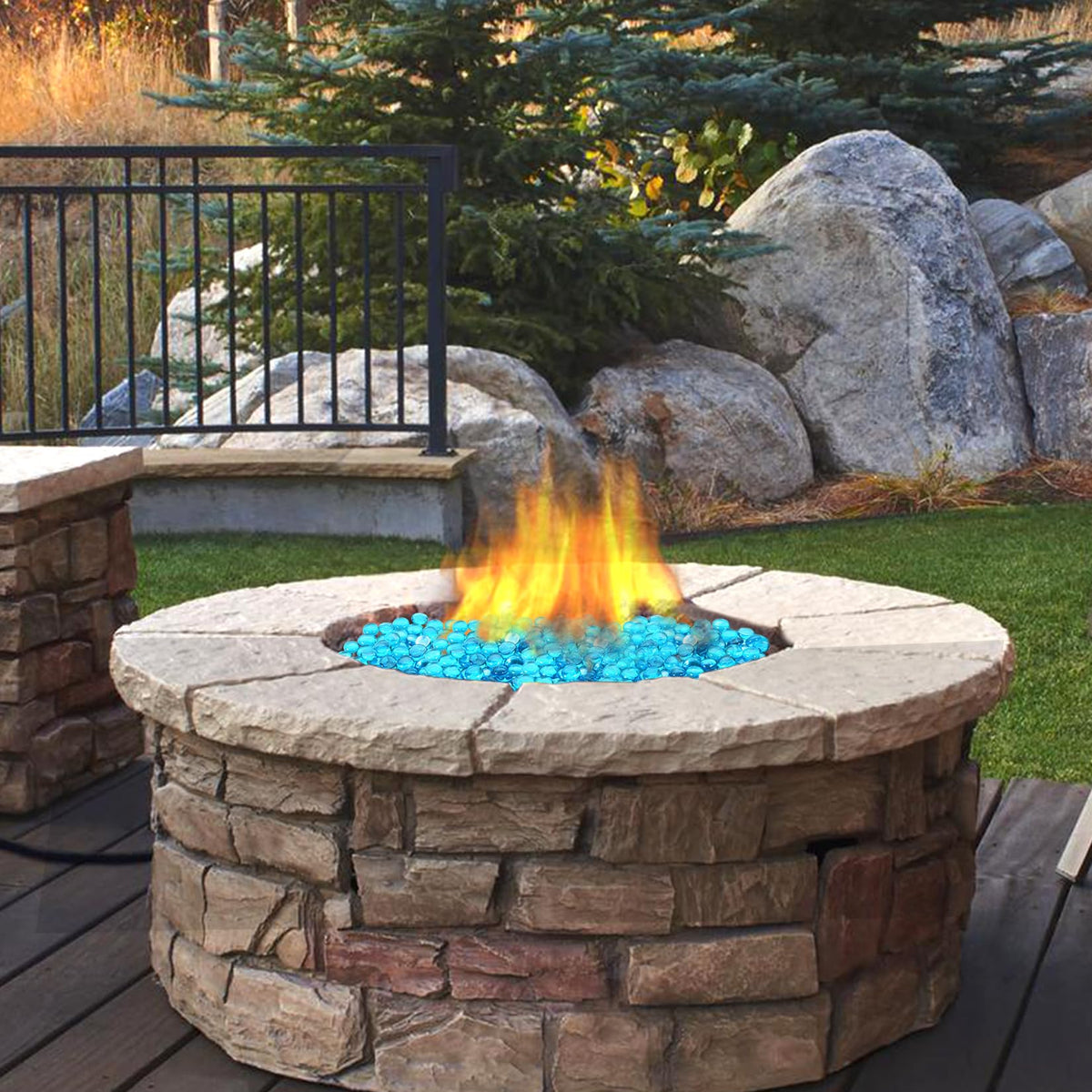Vchin Caribbean Blue glass rocks create ambiance in patio and garden.