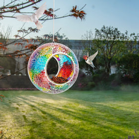 VCUTEKA round glass bird feeder hanging on wire sparkling in sunlight