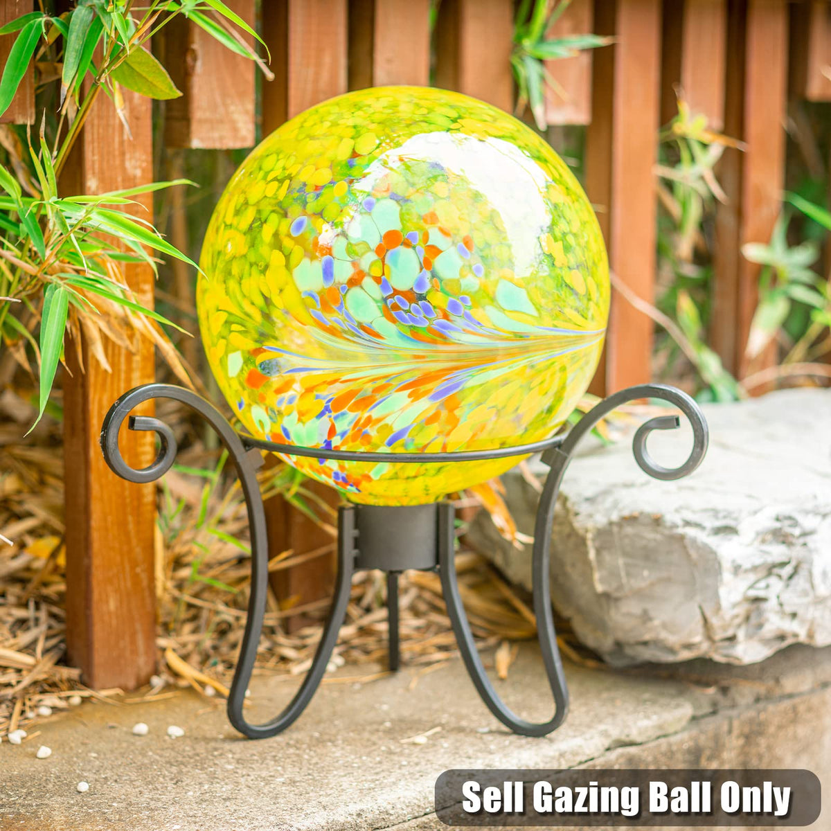 VCUTEKA Gazing Ball yellow swirl 10in reflects sunlight creating a sparkling effect.