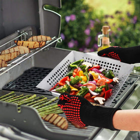 Vencino versatile basket doubles as grill tray or wok for cooking variety.
