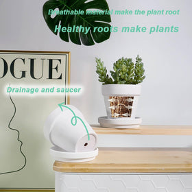 Vensovo white terracotta pot on a balcony, ideal for outdoor decor.