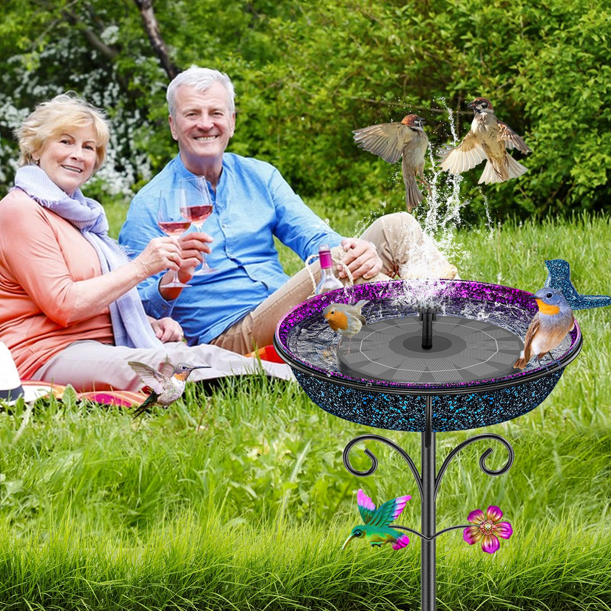 VeyFolzin.st birdbath with colorful hummingbird decorations attracts vibrant visitors.