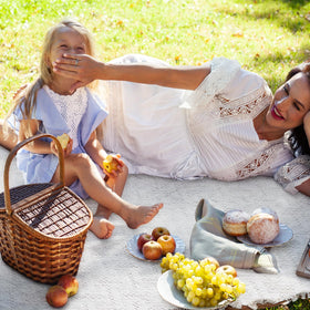 VitalCozy foldable blanket with carry strap for simple transport to parks or beaches.