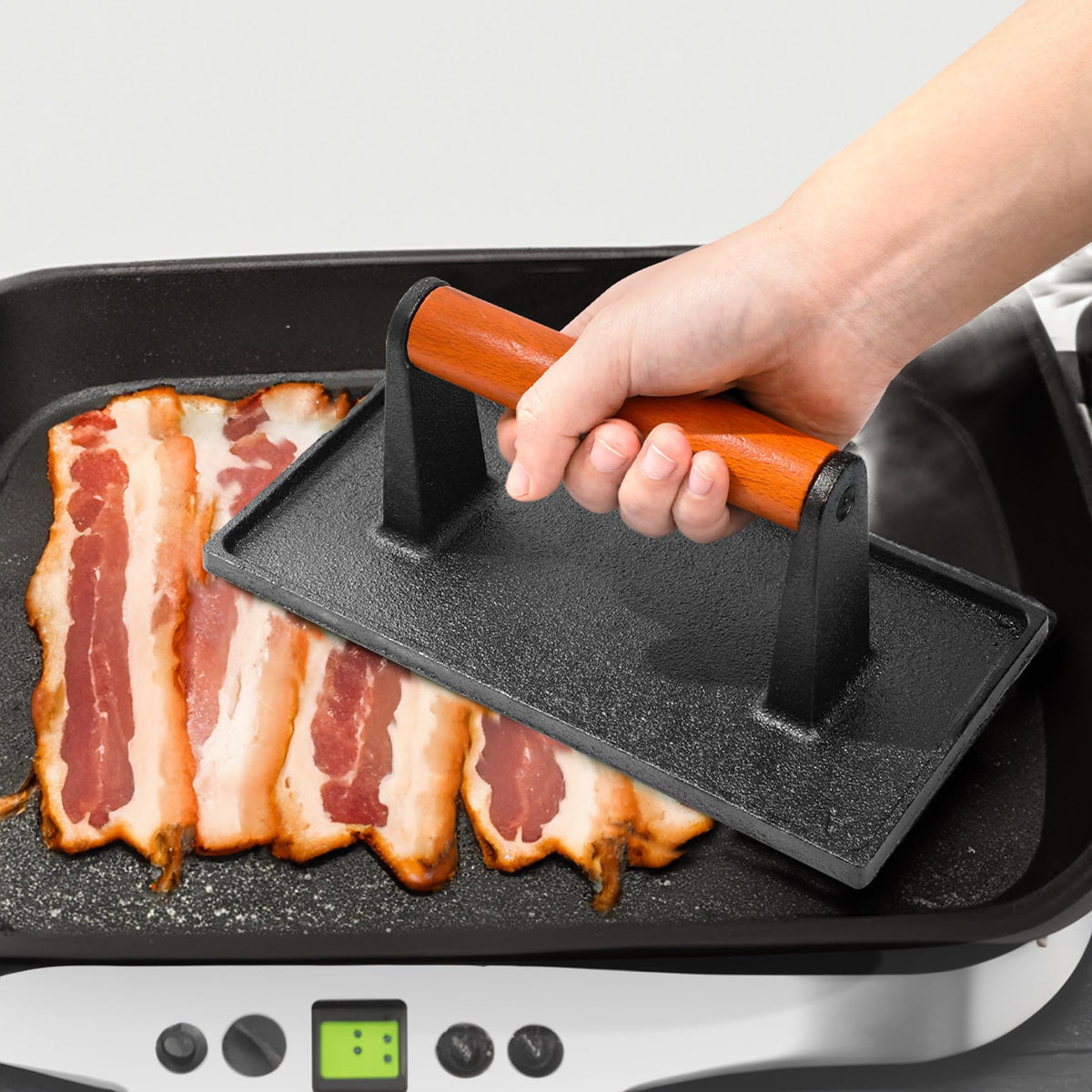 Vivicreate pressing a burger on the stovetop with the rectangle design