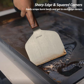 Vovoly griddle scraper cleaning burnt residue from a surface.