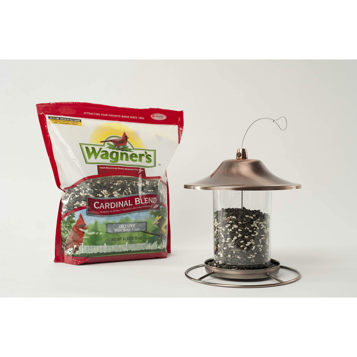 Cardinals and songbirds enjoying Wagner's Cardinal Blend at backyard feeder.