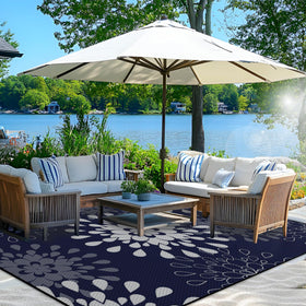 Wallona rug shown in a cozy patio setup, reversible design offers two looks.