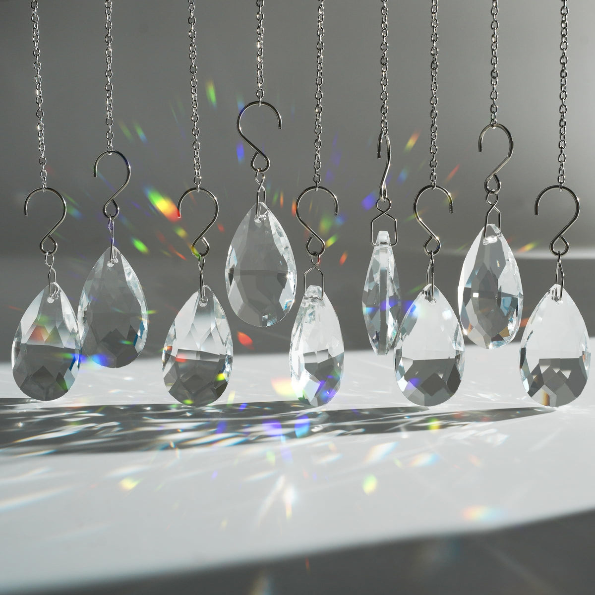 WASTROYAL crystal sun catcher teardrop prism 38mm catching sunlight on a window