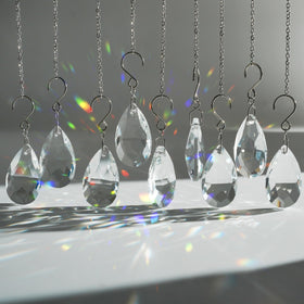 WASTROYAL crystal sun catcher teardrop prism 38mm catching sunlight on a window