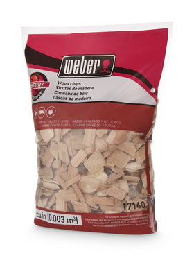 Weber Cherry Wood Chips on grill adding fruity aroma to food.