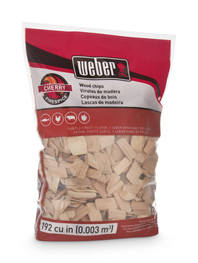 Weber Cherry Wood Chips smoke plume over grill enhancing your meal.
